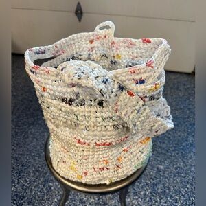 Handmade from plastic bags crocheted shopping tote bag with a pocket